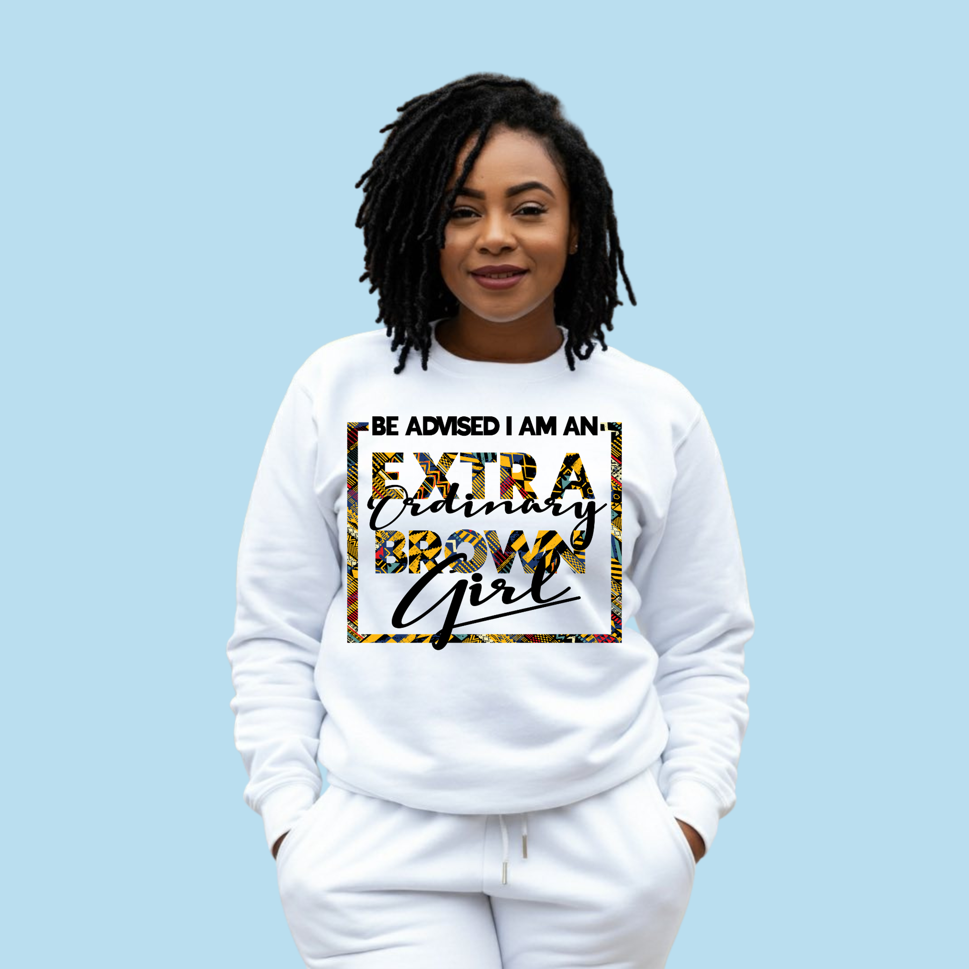 Person wearing a white long sleeved shirt with text