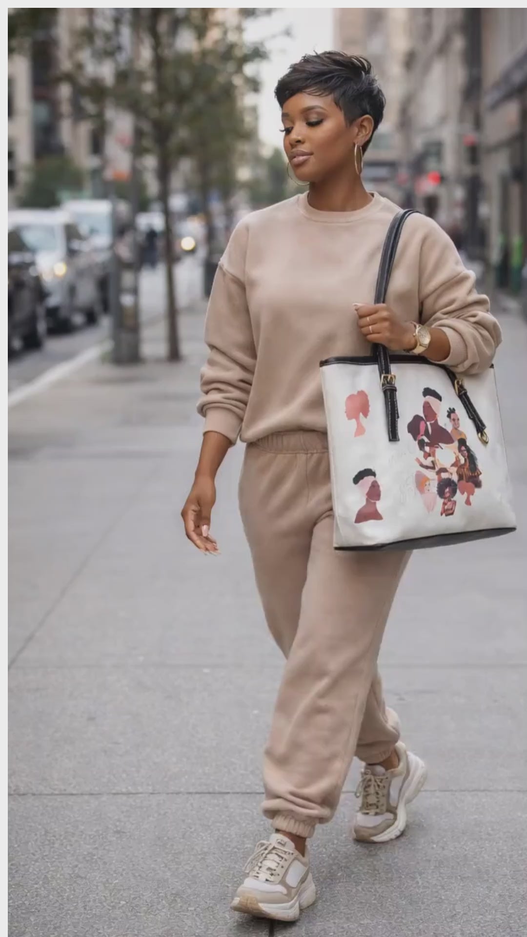 Roomy, zippered tote bag highligting the varied shades of melanin.